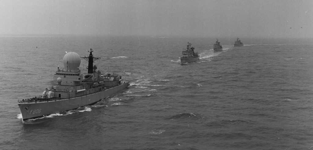 Departure of the HNLMS De Ruyter for the Fairwind 86 squadron voyage, followed by HNLMS Jan van Brakel, HNLMS Van Kinsbergen and HNLMS Callenburgh (from the Netherlands Institute of Military History)