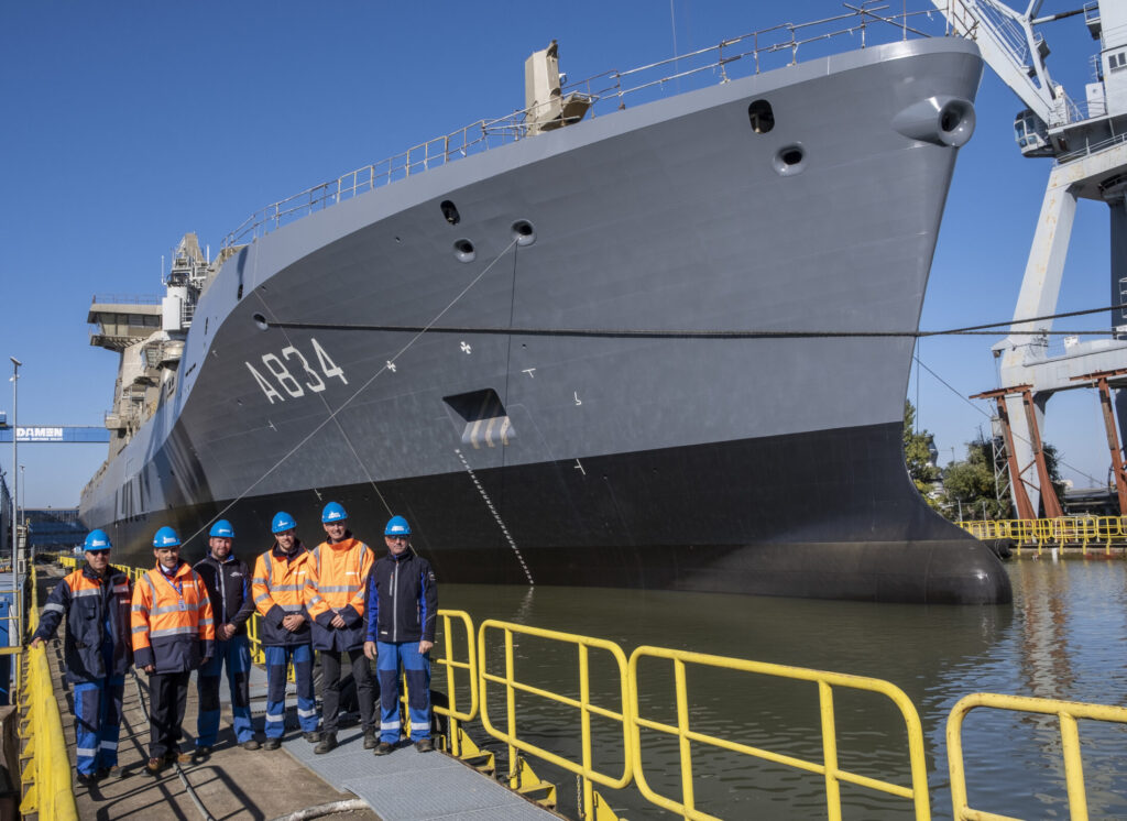 Arjan Risseeuw (second from left) and his team watched on as the ship was moved.